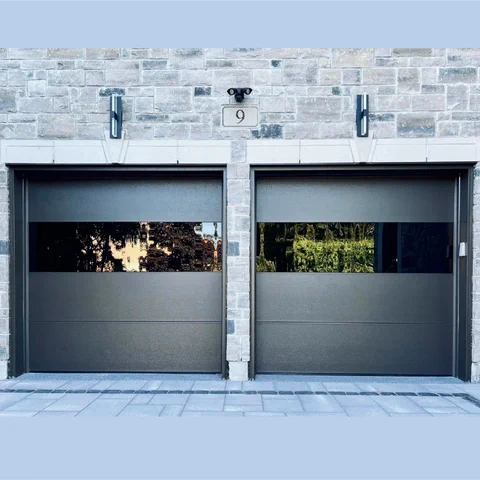 Pair of charcoal garage doors with full-width glass panels