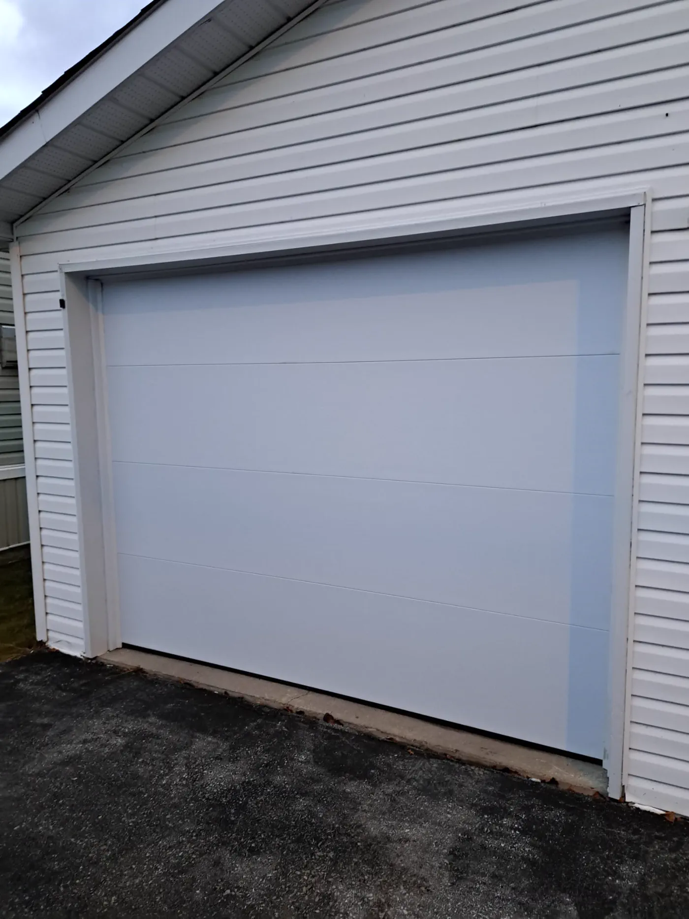 RedOak job archive photo showing garage-door work near collingwood